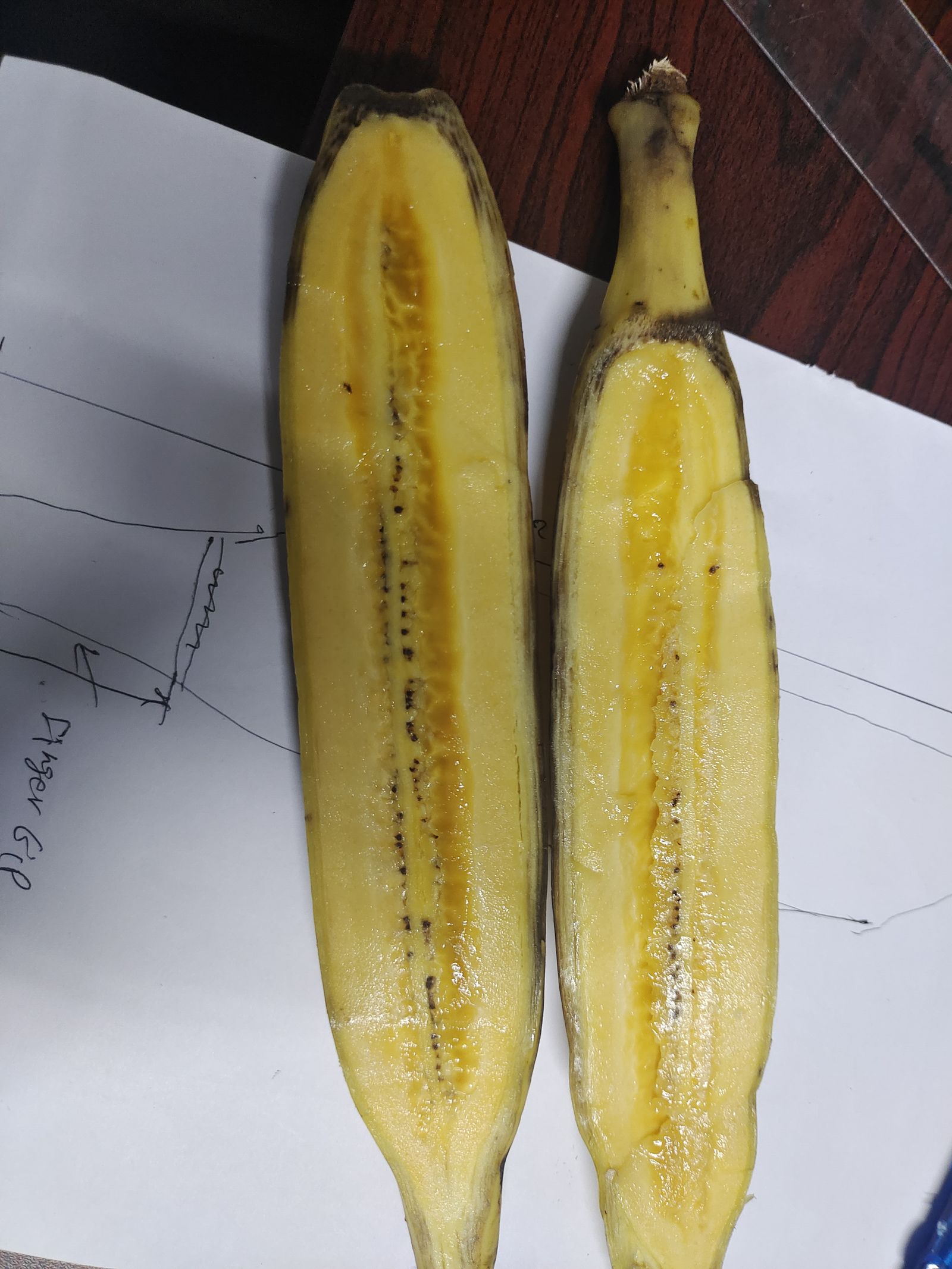 Bananas split open by hand to count every seed for ground truth.